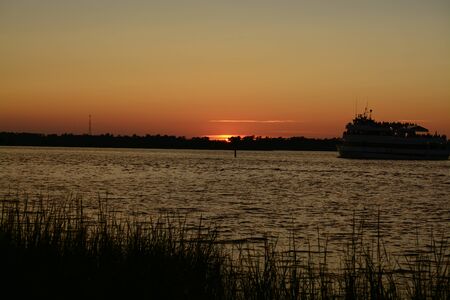An evening cruise along the cape fear river in north carolinaの写真素材