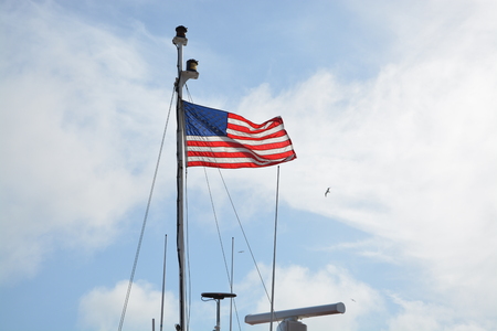American flag on a ship. Flying in the breezeの写真素材