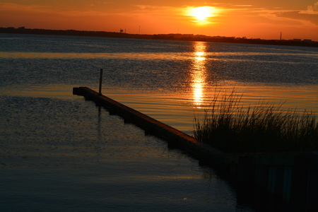 Sunset at the end of Pleasure Island in North Carolina.の写真素材