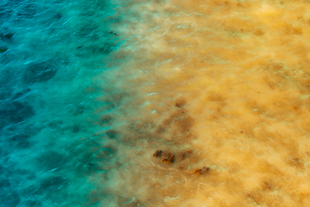Abstract background of azure and yellow reflections on the waterの写真素材
