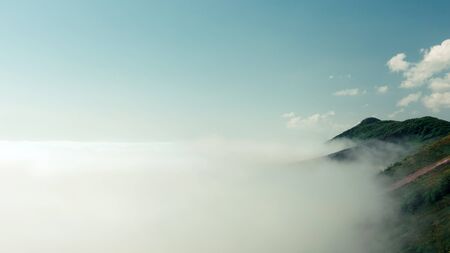 Beautiful landscape nature in morning on peak mountain with sunlight cloud fog and bright blue sky. Gelendzgik, North Caucasus, Russiaの写真素材