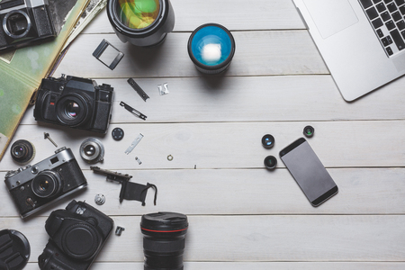 Vintage film camera, dslr camera and cellphone technology development concept. Flat layの写真素材