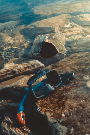 Mask For Freeiving And Snorkel Lie On The Beach, On The Rocks. Tourism And Travel Conceptの写真素材