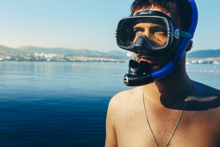Diver With Mask For Diving And Snorkel At The Sea Shore. Tourism Travel Journey Freediving Conceptの写真素材