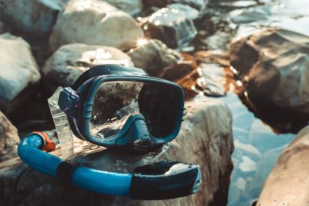 Mask For Freediving And Snorkel Lie On The Beach, On The Rocks, Closeup. Tourism And Travel Conceptの写真素材