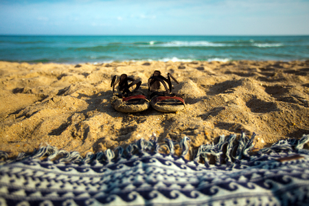 Summer Footwear And Plaid On The Sand Beach, Closeup Summer Vacation Conceptの写真素材