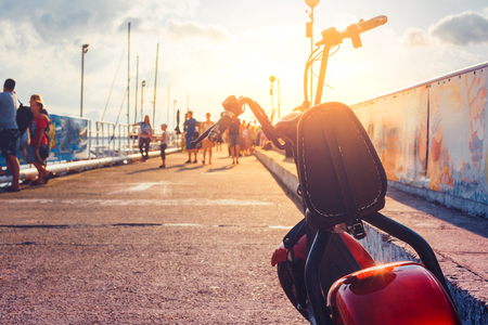 Electric Scooter Transport Vehicle, Rent For Tourist, Parked In Pier Ecologic Urban Transportation Conceptの写真素材