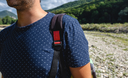 Unrecognizable Man Traveler With Backpack Is Engaged In Hiking In Mountains In Summerの写真素材