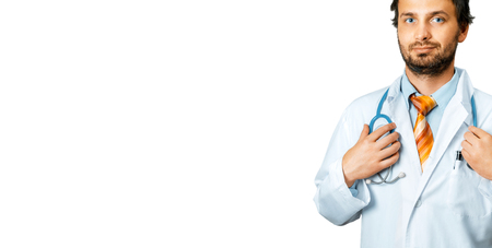 Friendly Doctor In White Coat Holds Hand On Stethoscope. People Care And Medicine Conceptの写真素材