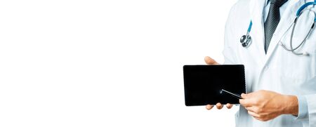 Doctor Using Digital Tablet In Consultation With Patientの写真素材