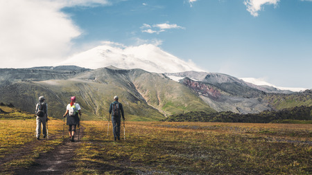 Hiking Team Goes To Mount Elbrus, Rear View. Travel Destination Experience Lifestyle Concept conceptの写真素材