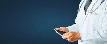 Man Doctor Using Digital Tablet With Copy-Spaceの写真素材