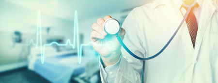 Hand Of Doctor With A Stethoscope In Hospital. Healthcare Medicine Conceptの写真素材