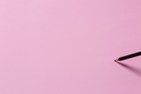 Pencil In Black On A Pink Surface With Copy-Space. Creative Conceptの写真素材