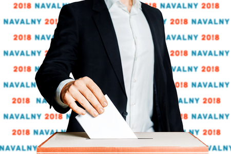 Man Putting A Ballot Into A Voting box. Democracy Elections In Russia NavalnyConceptの写真素材