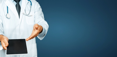 Doctor using tablet, results of testing and data registration, patient consent. Healthcare And Medicineの写真素材
