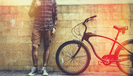 Outdoor Portrait Unrecognizable Man Traveler With Bicycle in The Streetの写真素材