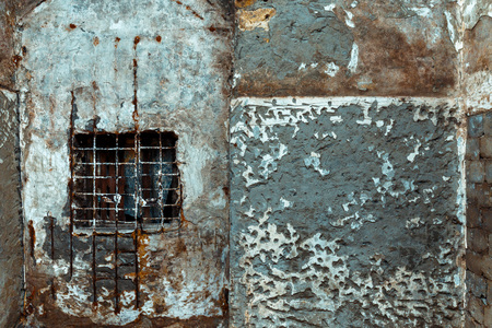 Concrete wall with window and cage, abstract textureの写真素材