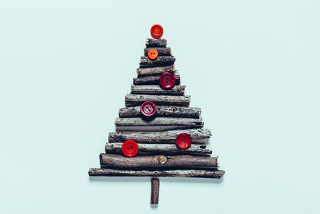 Christmas Tree Made Of Tree Branches And Buttins. Creative Celebration Conceptの写真素材