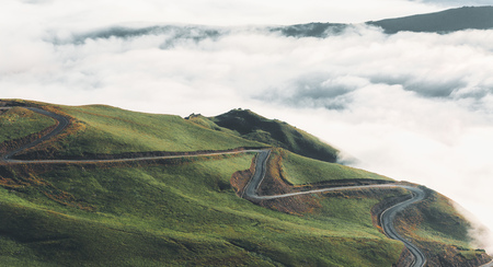 Winding Road In The Mountains Of The North Caucasus Against The Background Of Cloudsの写真素材