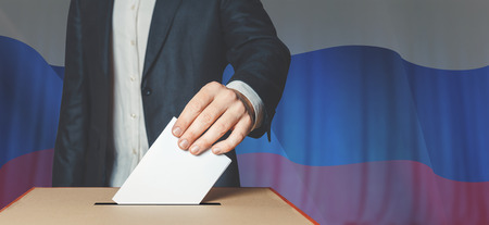 Man Voiter Putting Ballot Into Voting box. Democracy Freedom Conceptの写真素材