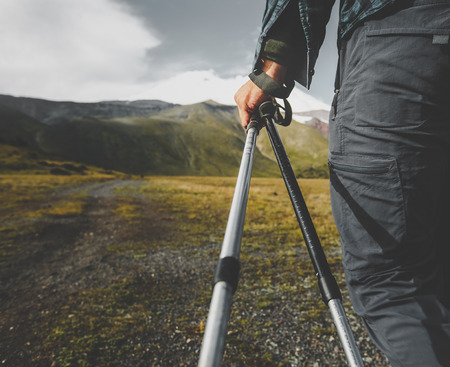 Traveler Man With Trekking Poles, Rear View Closeup. Tourism Lifestyle Mountains Conceptの写真素材