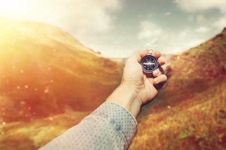 Man Explorer Searching Direction With Compass In Summer Mountains, Hand Point Of View Shot