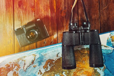 Adventure Journey Travel Scout Journey Concept. Vintage Film Camera, Map And Binoculars On Wooden Table, Flat Layの写真素材