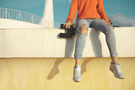 Unrecognizable Girl  Traveler With Binoculars Sits On A Balustrade And Looks Into The Distanceの写真素材