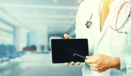 Medicine And Healthcare Concept. Doctor Using Digital Tablet In Consultation With Patientの写真素材