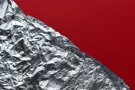 Silver Aluminum Foil On Red Background Texture, Flat Layの写真素材