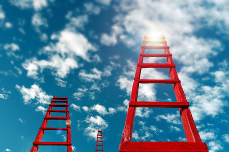 Red wooden staircase against the blue skyの写真素材