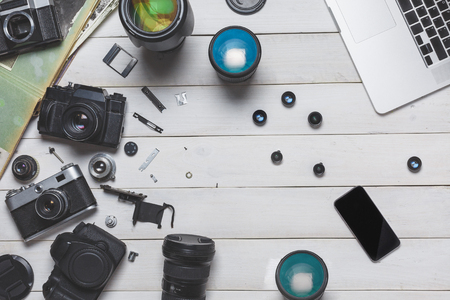 Vintage film camera, dslr camera and smartphone. Technology development concept. Top Viewの写真素材