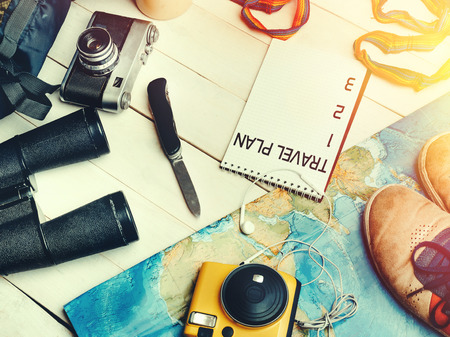 Travel Adventure Hiking Concept. Traveler's Accessories And Hiking Plan On The Wooden Table, Essential vacation items, Top Viewの写真素材