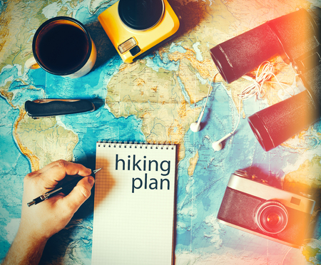 Traveler makes a trip hiking plan. camping gear, top viewの写真素材