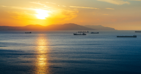 Bulk-carrier Ship At Sunset In The Sea On Sunset. Gelendzhik, Russiaの写真素材