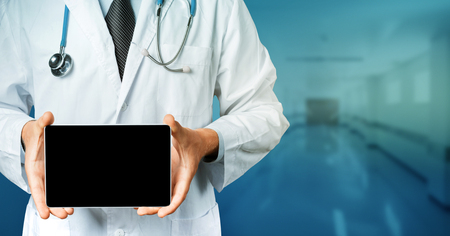 Doctor Holding Blank Digital Tablet With Copy-space And Clipping Path For Screen. Modern Technology In Medicine Conceptの写真素材