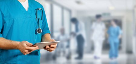 Concept of global medicine and healthcare. Doctor holds digital tablet. Diagnostics and modern technologyの写真素材