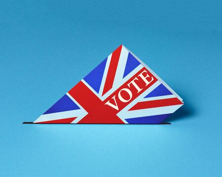 Electoral Bulletin with British flag Falls Into Urn. Elections Vote Freedom Democracy Independence Referendum Conceptの写真素材