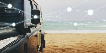 Adventure Travel Lifestyle Road Trip Concept. Unrecognizable car on sandy beach against  background...