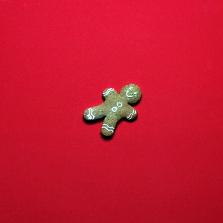 Gingerbread Man Classic Cookie Hero On Red Background. Global concept of new year and christmas