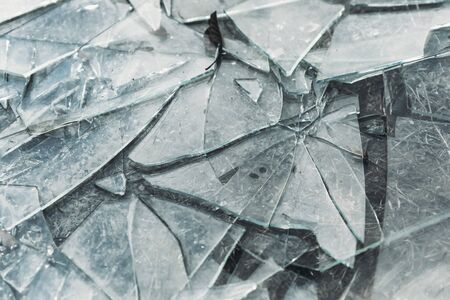 Broken glass is scattered a lot. Glass shards. Insurance, Damage, decline, destruction, vandalism,...