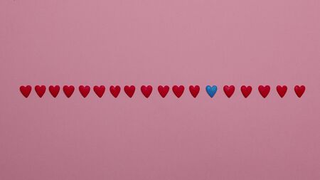 Red Hearts In A Row On Pink Background.  Valentines Day Love Decor Background Conceptの写真素材