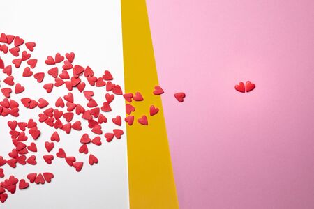 Hearts on white and pink background, flat lay. Global concept and symbol of love. Love and holiday...