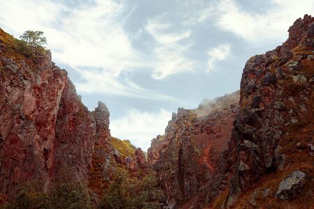 Red mountains against the blue sky, hills landscape with Elbrus region. Outdoor Adventure Concept の写真素材