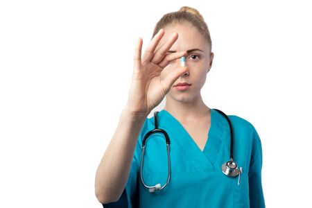 Medicine and Healthcare Concept. Female Doctor with Pill in Hospital on isolated background with copy-space and soft focus bokehの写真素材