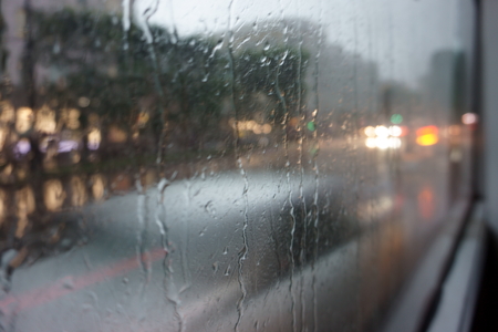 rainy day in the city. view from the bus window. rain on the glass