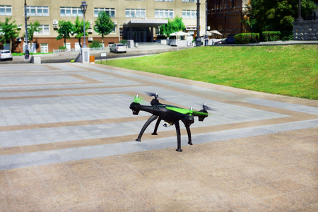 quadcopter prepared for fligh. flies in the city on the squareの写真素材