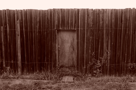 old fence with wicket. sepia. abandoned houseの写真素材