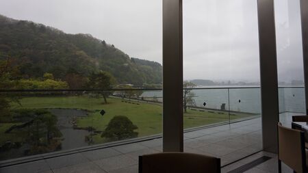 Cloudy rainy day outside the window. Along the road at Kawaguchi lake, Japanの写真素材